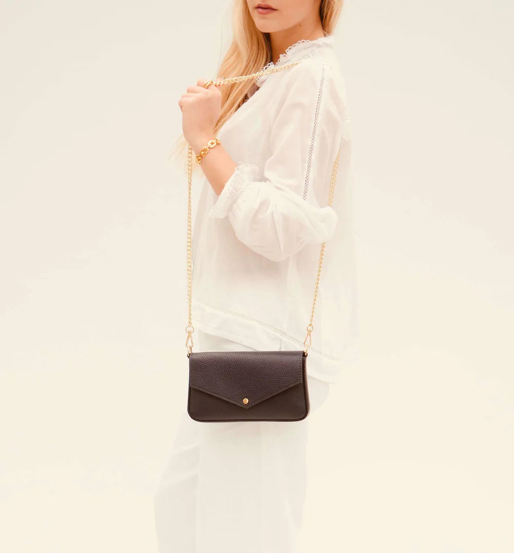 The Munro black leather shoulder bag featuring a sleek, sophisticated design with versatile compartments for everyday use-5