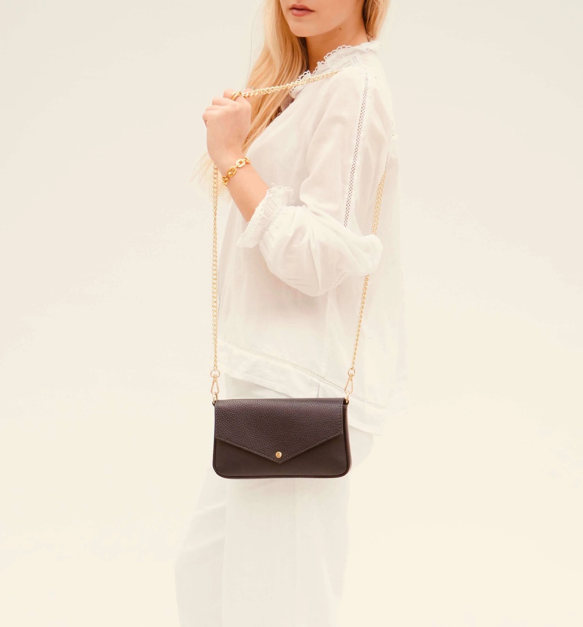 The Munro black leather shoulder bag featuring a sleek, sophisticated design with versatile compartments for everyday use-6