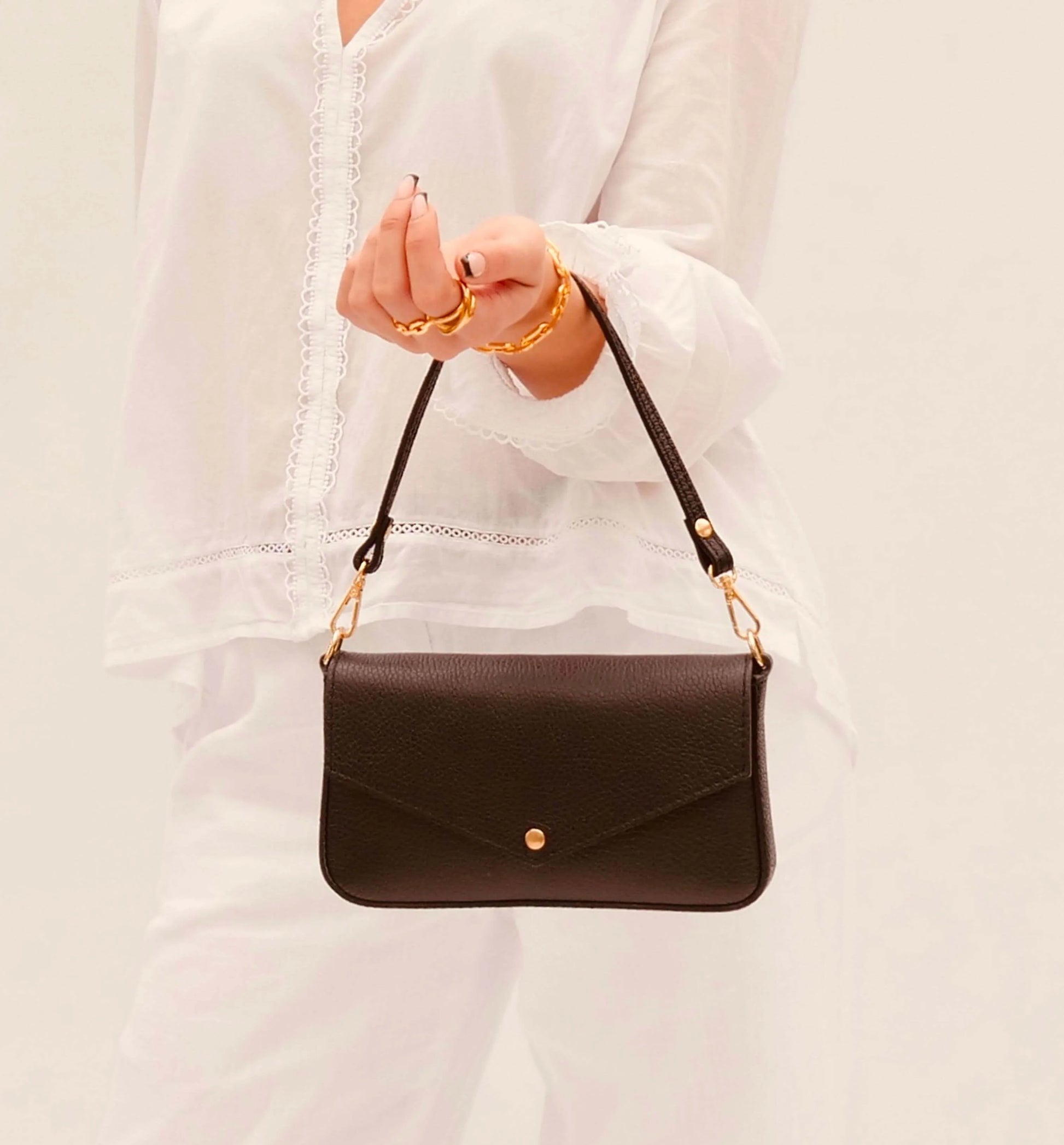 The Munro black leather shoulder bag featuring a sleek, sophisticated design with versatile compartments for everyday use-7